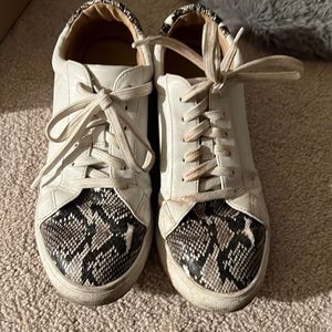 White and snakeskin sneakers